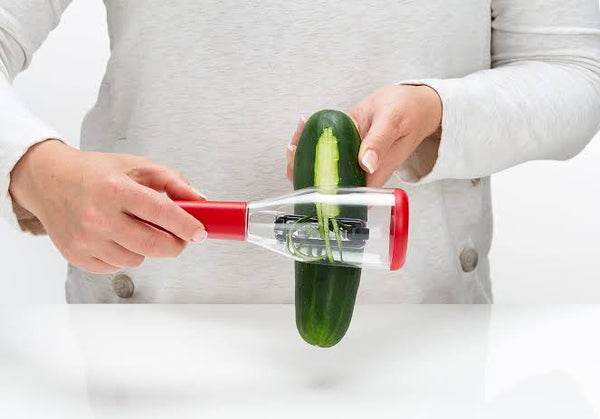 Peeler with container